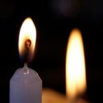 Mystical Ambiance - Two Lit Candles in Dark