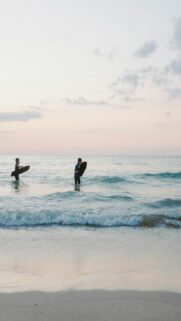 Coastal Vibes: Surfers Riding Waves