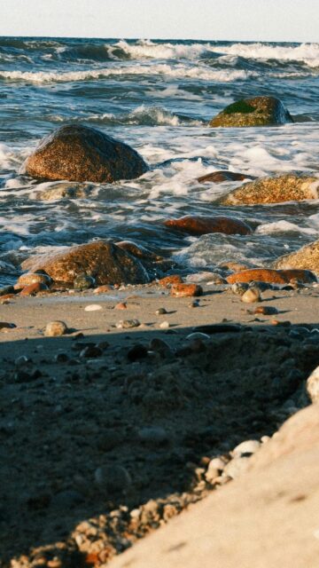Waves Crash On Rocky Beach