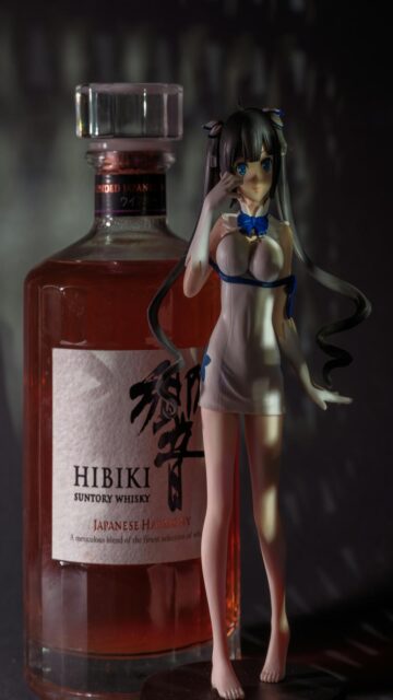 Whiskey And Anime Figures Side By Side