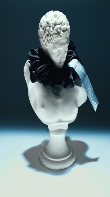 Elegant White Marble Bust with Black Ruffled Collar