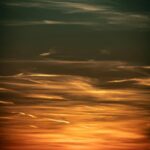Vibrant Sunset Background With Wind Turbines