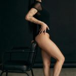 Elegant Woman in Black Bodysuit