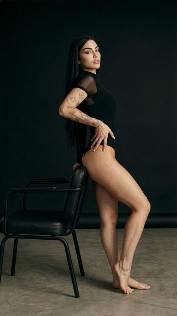 Elegant Woman in Black Bodysuit