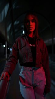 Red Light Moment – Woman in Denim Jacket