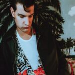 Retro Vibes: Young Man in Tropical Mural Background