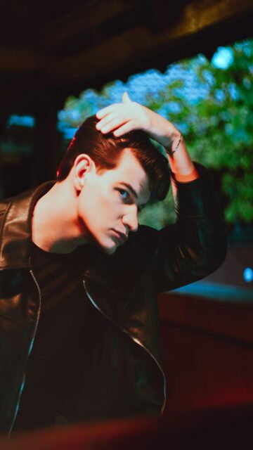 Slicked Back Hair Leather Jacket Mobile Wallpaper
