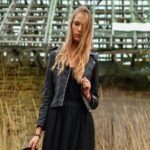 Mobile Wallpaper: Young Woman in Black Dress & Jacket