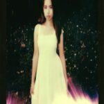 Young Woman In White Dress With Flames Below