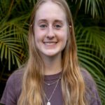Lush Green Escapes: Young Woman Smiling