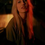 Blonde Hair Illuminated By Red Light