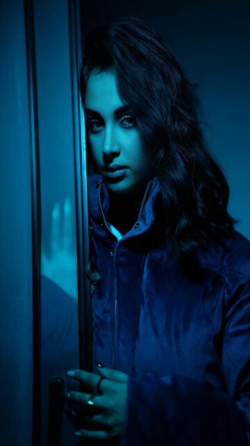 Dark Haired Woman in Blue Jacket Wallpaper