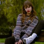 Vibrant Moments: Young Woman with Red Lipstick on Park Bench