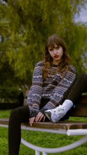 Vibrant Moments: Young Woman with Red Lipstick on Park Bench