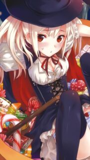Cute Anime Witch Surrounded by Candy Halloween Wallpaper for Mobile