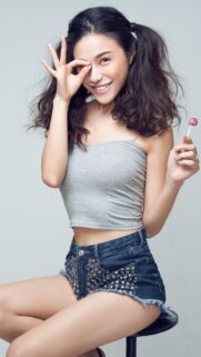 Beautiful Smiling Girl With Pigtails Holding A Lollipop High Quality Mobile Wallpaper