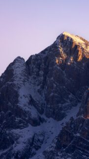 Majestic Snow Capped Mountain Peak at Sunrise Mobile Wallpaper
