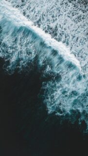 Stunning Aerial View of Deep Blue Ocean Waves High Resolution Wallpaper