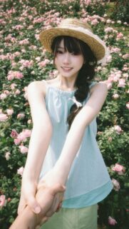 Anime Style Girl Holding Hands in a Beautiful Pink Rose Garden Wallpaper