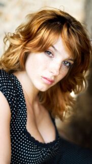 Beautiful Redhead Woman with Freckles and Polka Dot Dress Mobile Wallpaper