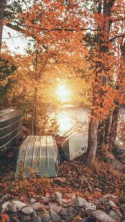 Beautiful Autumn Lakeside Landscape with Boats Wallpaper for Mobile