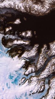 Stunning Aerial View of Arctic Glaciers and Frozen Fjords Mobile Wallpaper