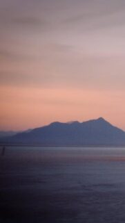Minimalist Mountain Sunset Over Calm Sea Mobile Wallpaper