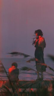 Melancholic Anime Couple Standing by the Sea at Sunset Mobile Wallpaper