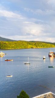 Stunning Coastal Harbor Landscape with Sailing Boats Wallpaper