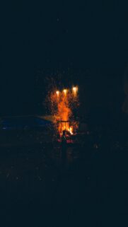 Fiery Bonfire Sparks in the Night Sky Mobile Wallpaper