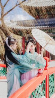 Two Girls in Traditional Chinese Hanfu with Umbrella Wallpaper