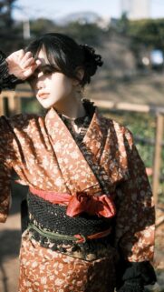 Elegant Young Woman in Traditional Floral Kimono Portrait Wallpaper