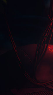 Dark Cyberpunk Aesthetic with Red Glowing Cables and Industrial Texture Mobile Wallpaper