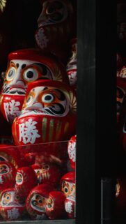 Traditional Japanese Daruma Dolls Red Lucky Charm Vertical Wallpaper