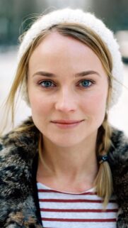 Stunning Portrait of a Woman with Blue Eyes and White Knit Beanie Mobile Wallpaper