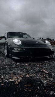 Low Profile Black Porsche 911 Sportscar Moody Automotive Wallpaper for Mobile