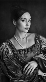 Elegant Renaissance Style Portrait of a Woman with Pearl Jewelry Wallpaper