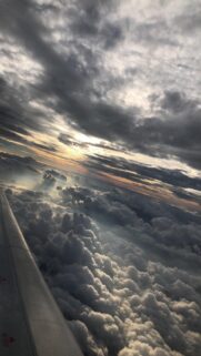 Stunning Aerial View of Clouds at Sunset Airplane Window Mobile Wallpaper