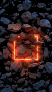 Glowing Neon Square Amidst Rough Dark Rocks Wallpaper