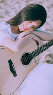 Beautiful Girl Relaxing with Acoustic Guitar Mobile Wallpaper High Resolution
