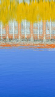 Abstract Water Reflection Wallpaper featuring Vibrant Yellow Orange and Blue Tones