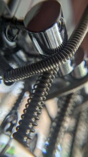 Macro Photography of Metallic Guitar Strings and Chrome Hardware Wallpaper