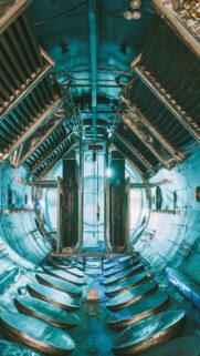 Futuristic Industrial Tunnel Corridor with Teal Lighting 4K Mobile Wallpaper