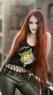 Stunning Portrait of a Stylish Young Woman with Vibrant Red Hair Wallpaper
