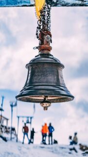 Sacred Temple Bell in the Snowy Himalayas High Quality Mobile Wallpaper