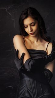 Elegant Woman in Black Silk Dress and Opera Gloves Mobile Wallpaper
