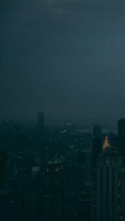 Moody Dark City Skyline Wallpaper for Mobile at Night