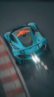 Stunning McLaren P1 GTR High-Speed Racing Wallpaper in Blue and Orange