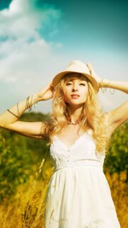 Beautiful Blonde Girl in White Dress and Hat in Sunny Field Wallpaper