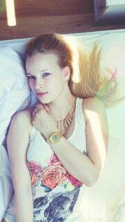 Beautiful Blonde Girl Lying Down With Floral Graphic Tee High Resolution Wallpaper
